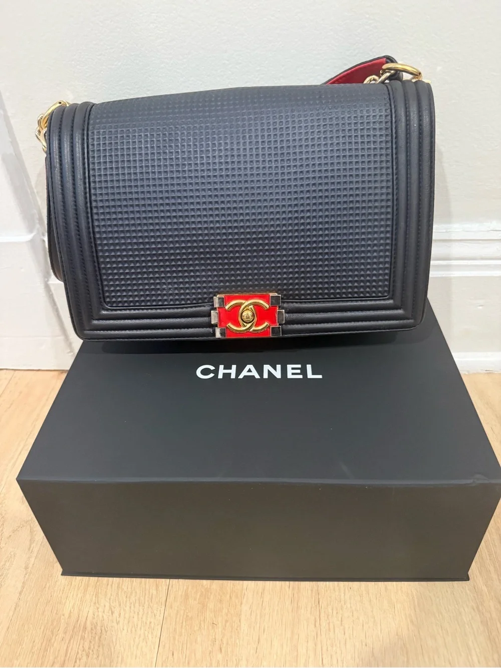 Authentic Chanel Navy Quilted Medium Boy Bag with Red & Gold Accent